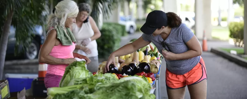 women shopping at fruit market
