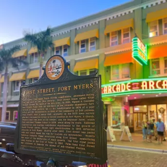 A large building with a sign in front of it
